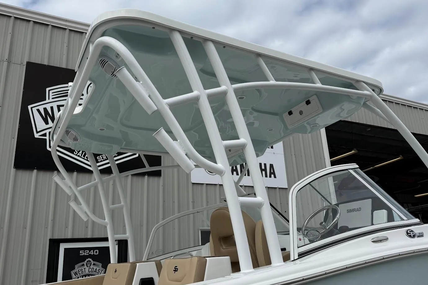 2026 Sea Pro 240 Dual Console boat with T-top, displayed at dealership.