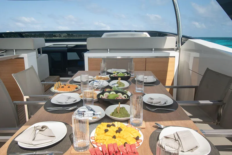 Muma Yacht Photos Pics Luxurious dining setup on 2016 Sanlorenzo SL96 yacht with ocean view.