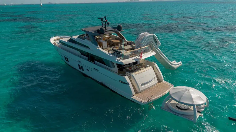 Muma Yacht Photos Pics Sanlorenzo SL96 2016 yacht with slide and floating platform on turquoise sea.