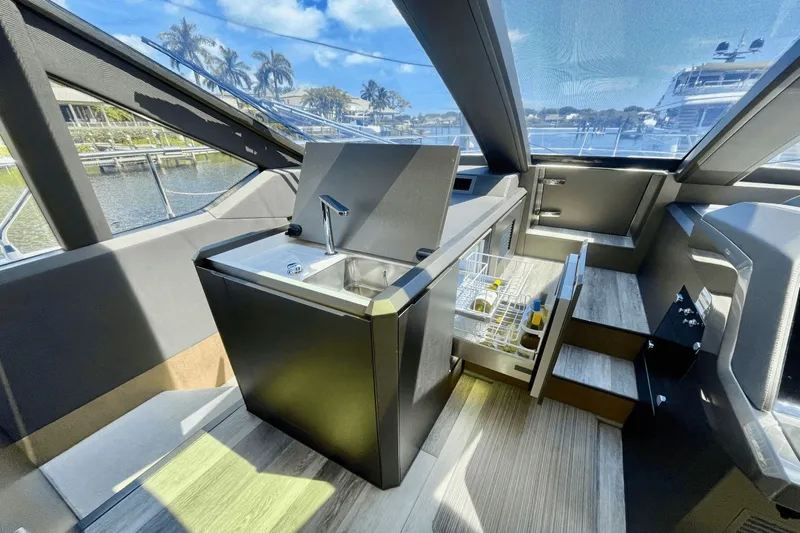  Yacht Photos Pics Modern kitchen area on 2021 Galeon 640 FLY BRIDGE yacht with sink and storage.