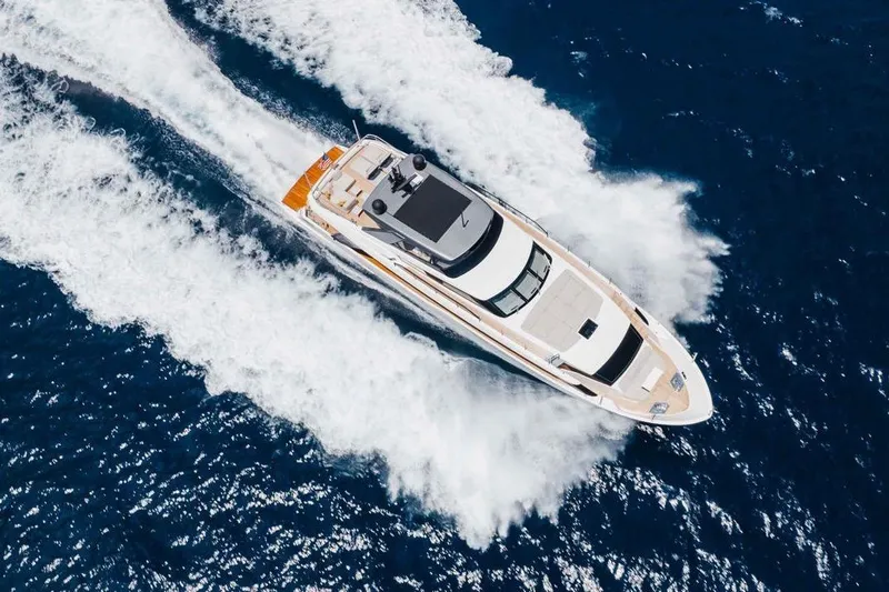 Chameleon Yacht Photos Pics Aerial view of 2024 Sanlorenzo SL90A yacht cruising on open blue sea.