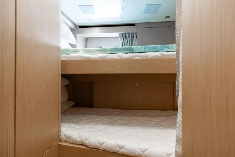 Chameleon Yacht Photos Pics 2024 Sanlorenzo SL90A yacht interior with modern bunk beds and wooden finish.