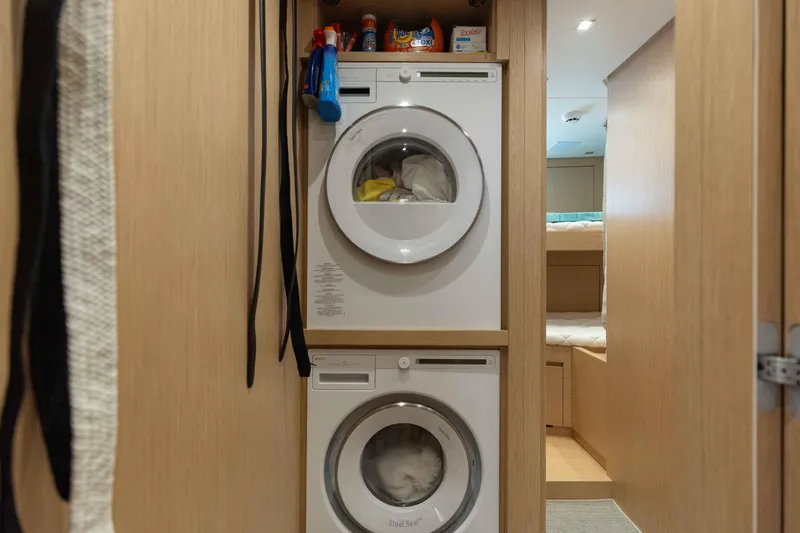 Chameleon Yacht Photos Pics Laundry area with stacked washer and dryer in 2024 Sanlorenzo SL90A yacht.