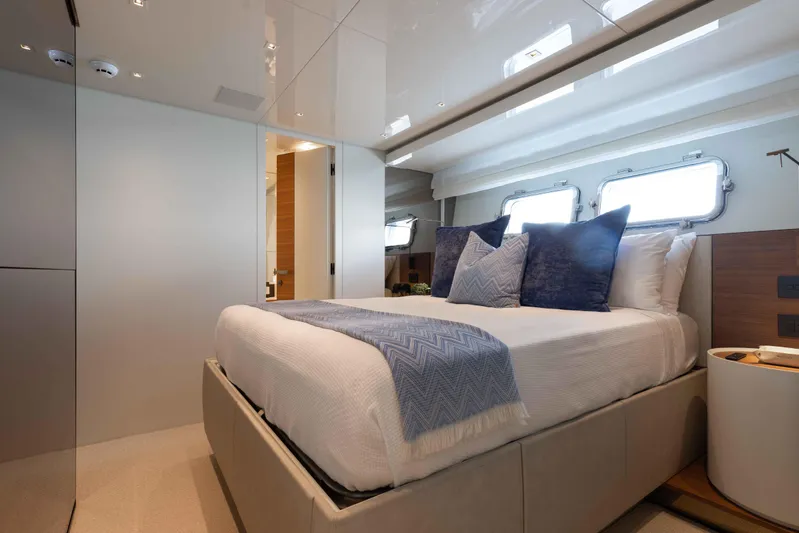 Chameleon Yacht Photos Pics Luxurious bedroom interior of 2024 Sanlorenzo SL90A yacht with modern design and elegant decor.