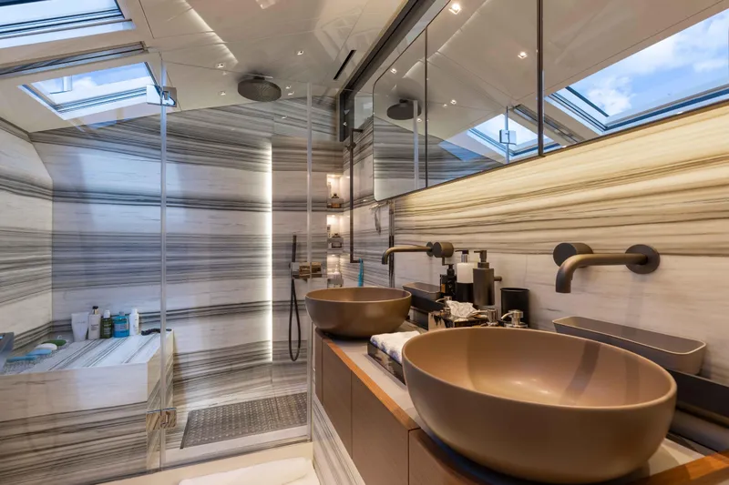 Chameleon Yacht Photos Pics Luxurious bathroom in 2024 Sanlorenzo SL90A yacht with modern fixtures and elegant design.