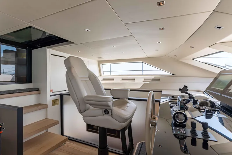 Chameleon Yacht Photos Pics Luxurious helm station of 2024 Sanlorenzo SL90A yacht with modern controls and seating.
