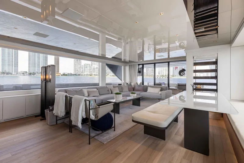 Chameleon Yacht Photos Pics Luxurious interior of 2024 Sanlorenzo SL90A yacht with modern furnishings and waterfront view.