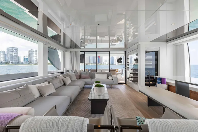 Chameleon Yacht Photos Pics Luxurious interior of 2024 Sanlorenzo SL90A yacht with modern furnishings and panoramic windows.
