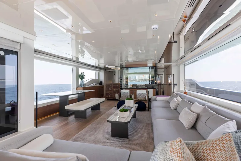 Chameleon Yacht Photos Pics Luxurious interior of 2024 Sanlorenzo SL90A yacht with ocean view and modern furnishings.