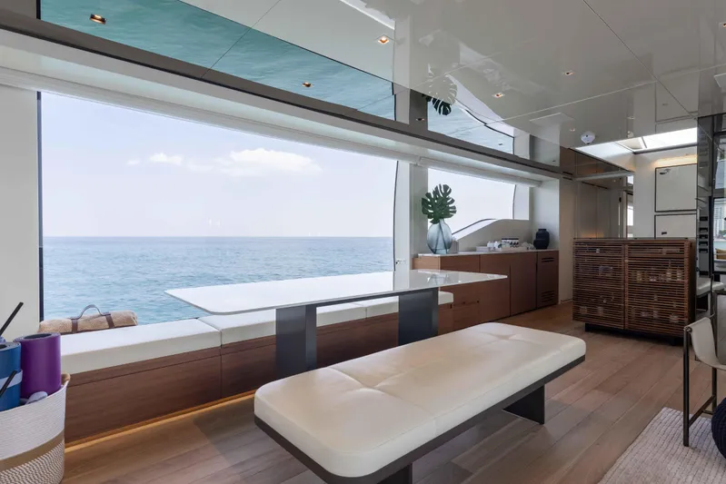 Chameleon Yacht Photos Pics Luxurious interior of 2024 Sanlorenzo SL90A yacht with ocean view and modern furnishings.
