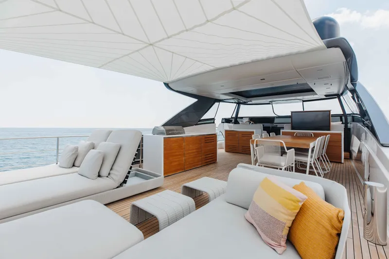 Chameleon Yacht Photos Pics Luxurious 2024 Sanlorenzo SL90A yacht deck with elegant seating and ocean view.