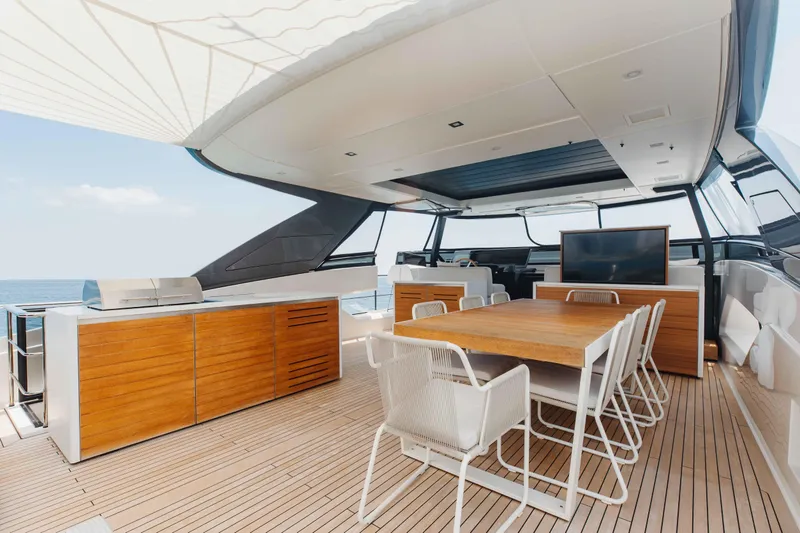 Chameleon Yacht Photos Pics Luxurious 2024 Sanlorenzo SL90A yacht deck with dining area and modern amenities.