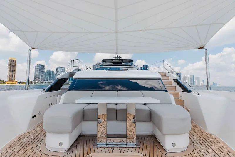 Chameleon Yacht Photos Pics Luxurious 2024 Sanlorenzo SL90A yacht deck with modern seating and city skyline view.