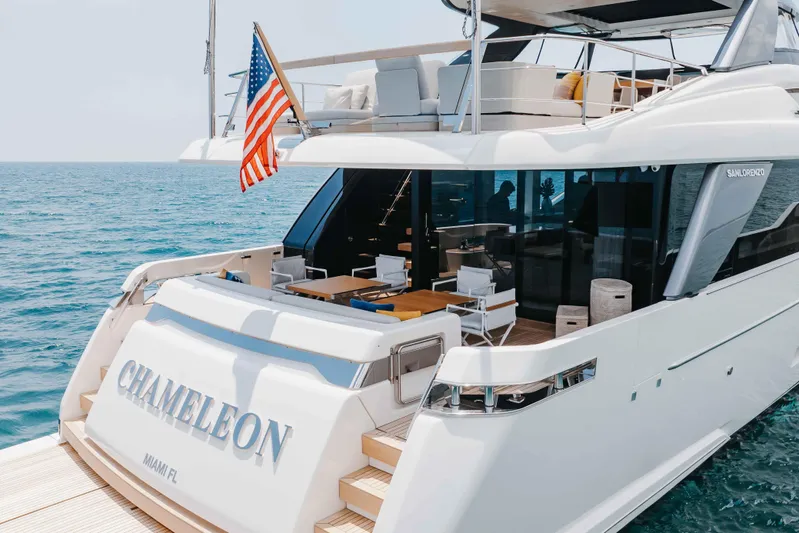 Chameleon Yacht Photos Pics 2024 Sanlorenzo SL90A luxury yacht "Chameleon" docked at sea, featuring elegant outdoor seating.