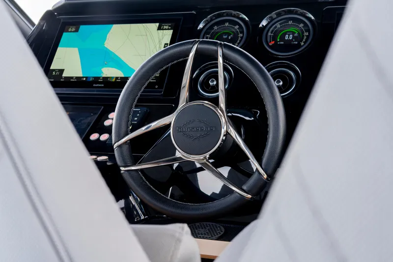  Yacht Photos Pics Steering wheel of 2024 Sunseeker Superhawk 55 yacht with navigation display.