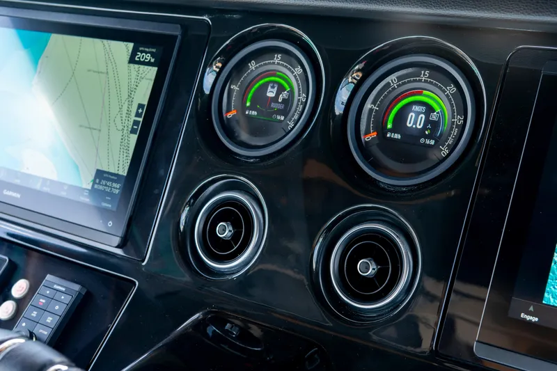  Yacht Photos Pics 2024 Sunseeker Superhawk 55 dashboard with navigation screen and gauges.