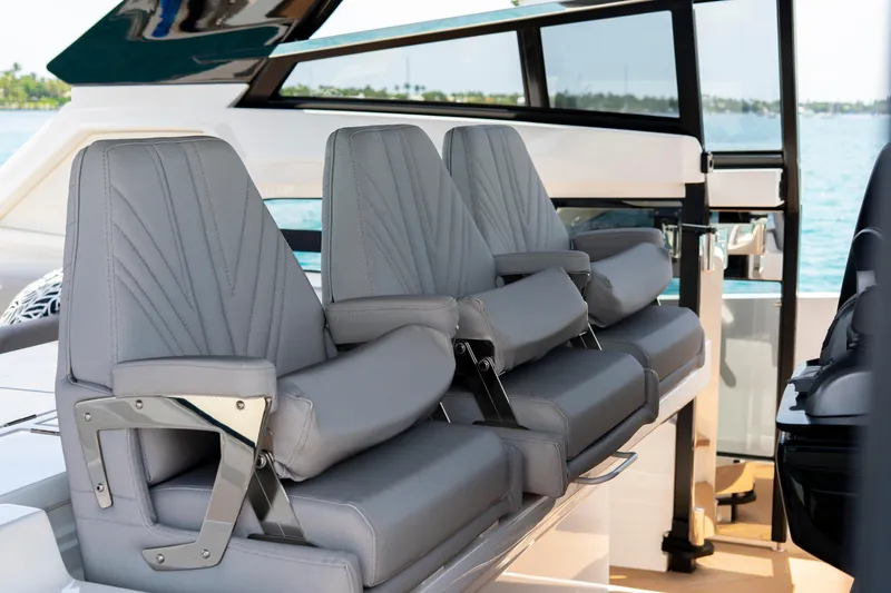  Yacht Photos Pics Luxury seating on 2024 Sunseeker Superhawk 55 yacht, featuring sleek design and comfort.