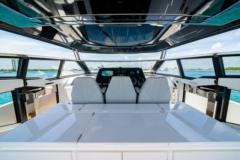  Yacht Photos Pics Luxurious interior of 2024 Sunseeker Superhawk 55 yacht with modern helm and panoramic views.