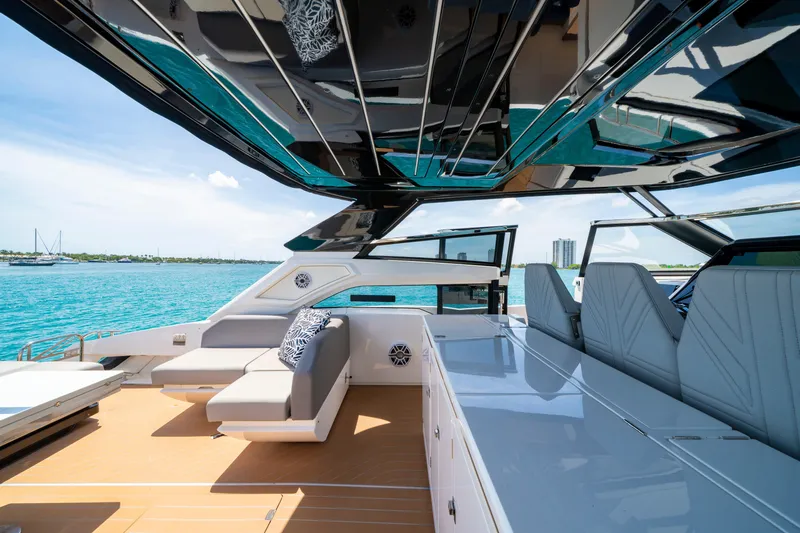  Yacht Photos Pics Luxurious 2024 Sunseeker Superhawk 55 yacht interior with sleek seating and ocean view.