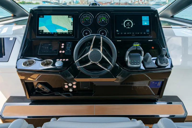  Yacht Photos Pics 2024 Sunseeker Superhawk 55 helm with advanced navigation displays and controls.
