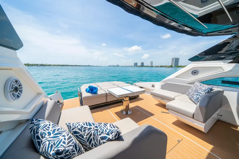  Yacht Photos Pics Luxurious 2024 Sunseeker Superhawk 55 yacht deck with ocean view and stylish seating.