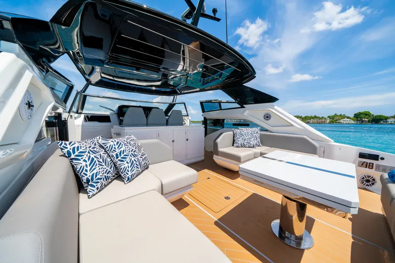  Yacht Photos Pics Luxurious 2024 Sunseeker Superhawk 55 yacht interior with plush seating and ocean view.