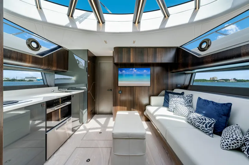  Yacht Photos Pics Luxurious interior of 2024 Sunseeker Superhawk 55 yacht with modern kitchen and seating area.