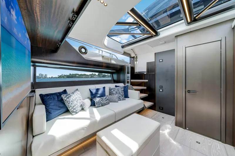  Yacht Photos Pics Luxurious interior of 2024 Sunseeker Superhawk 55 yacht with skylight and modern decor.