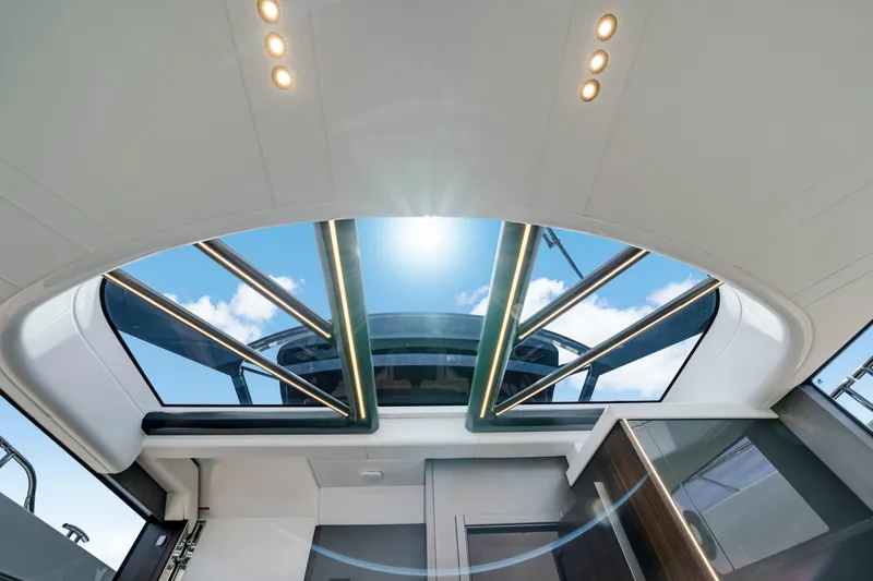  Yacht Photos Pics 2024 Sunseeker Superhawk 55 interior with panoramic sunroof and modern lighting.