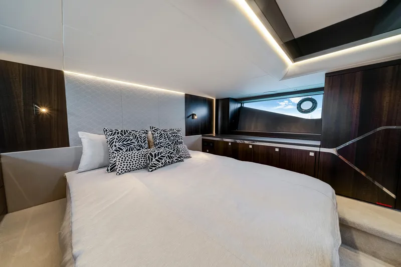 Yacht Photos Pics Luxurious bedroom interior of 2024 Sunseeker Superhawk 55 yacht with modern design elements.