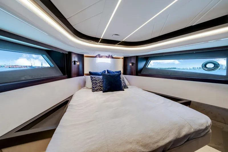  Yacht Photos Pics Luxurious bedroom interior of 2024 Sunseeker Superhawk 55 yacht with modern design and ocean views.