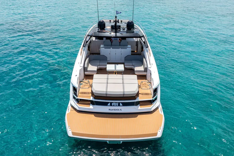  Yacht Photos Pics 2024 Sunseeker Superhawk yacht on clear blue water, showcasing luxurious deck design.