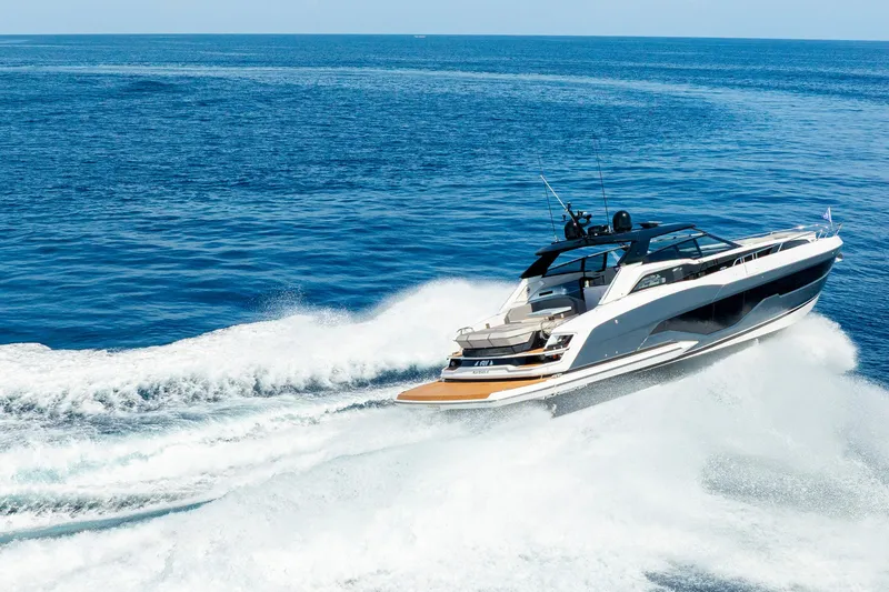  Yacht Photos Pics 2024 Sunseeker Superhawk yacht cruising on open sea, creating dynamic waves.