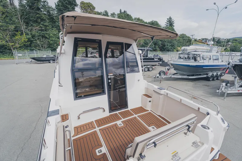  Yacht Photos Pics 2025 Ranger Tugs R-23 boat with teak deck, docked outdoors.