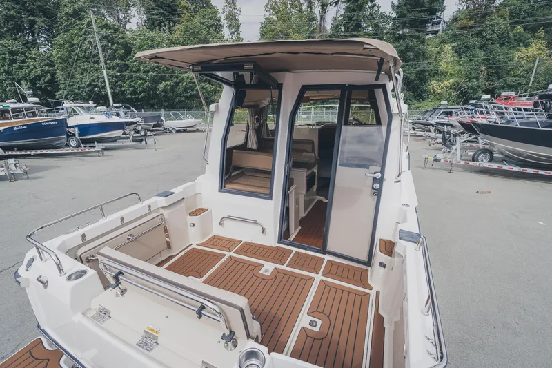  Yacht Photos Pics 2025 Ranger Tugs R-23 boat with teak deck, docked outdoors.