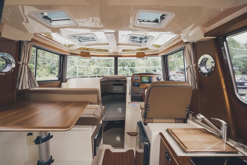  Yacht Photos Pics Interior of 2025 Ranger Tugs R-23 boat, featuring modern design and wood accents.