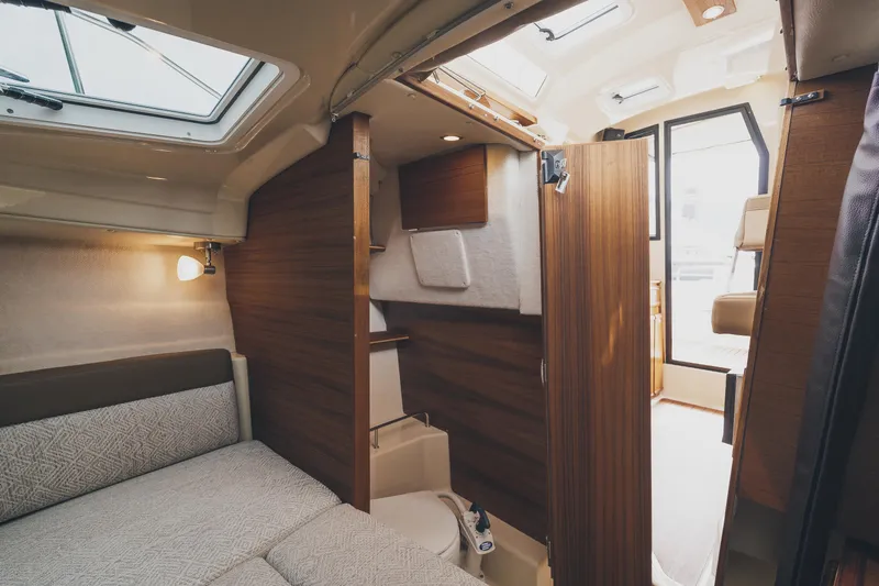  Yacht Photos Pics Interior of 2025 Ranger Tugs R-23 boat, featuring cozy cabin and modern design elements.