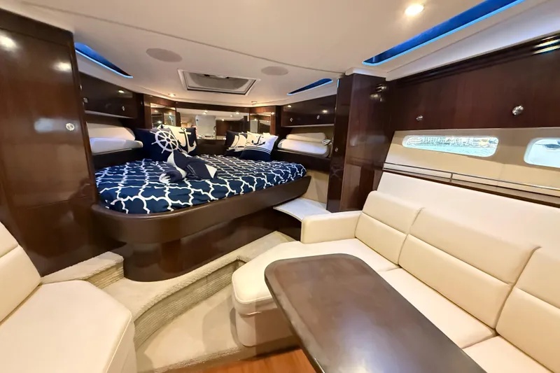  Yacht Photos Pics Luxurious interior of 2015 Sea Ray 350 Sundancer yacht with elegant seating and bedding.