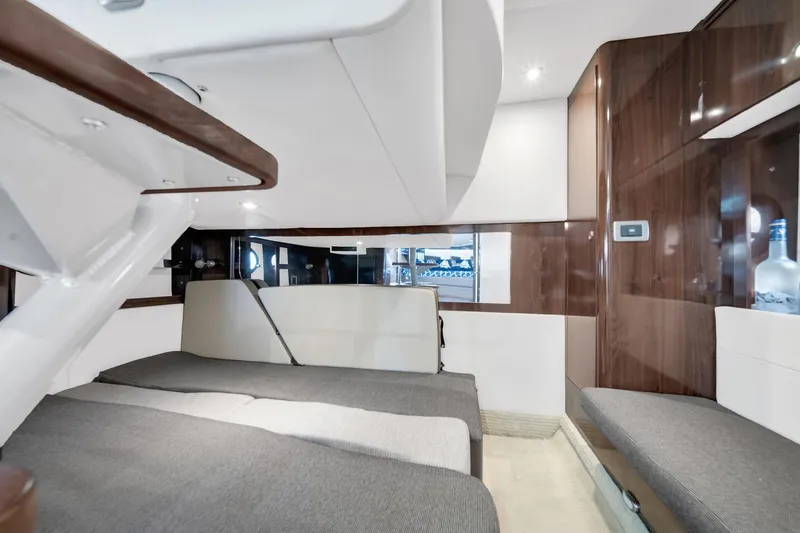  Yacht Photos Pics Interior cabin of 2015 Sea Ray 350 Sundancer yacht, featuring modern design and comfortable seating.