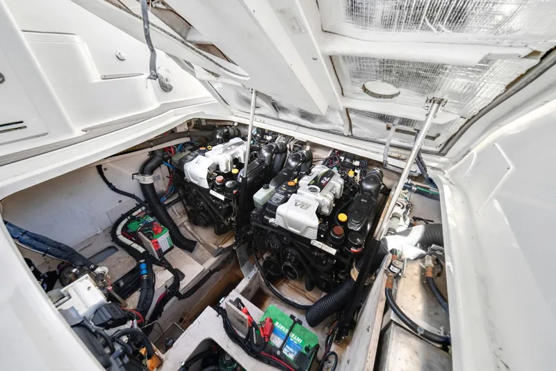  Yacht Photos Pics Engine compartment of 2015 Sea Ray 350 Sundancer, showcasing dual engines and wiring.