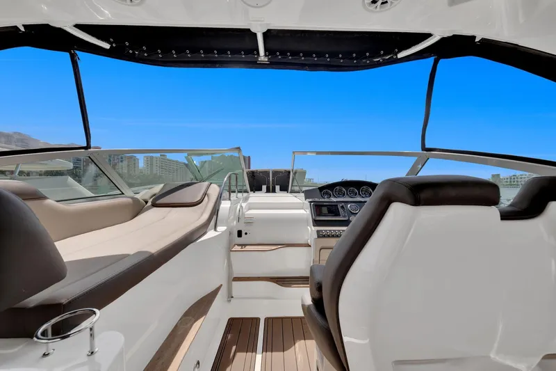  Yacht Photos Pics 2015 Sea Ray 350 Sundancer cockpit with luxurious seating and modern dashboard.