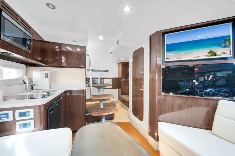  Yacht Photos Pics Interior of 2015 Sea Ray 350 Sundancer yacht with modern kitchen and seating area.