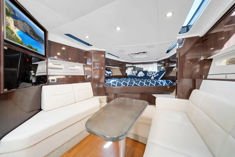  Yacht Photos Pics Luxurious interior of 2015 Sea Ray 350 Sundancer yacht with elegant seating and modern decor.