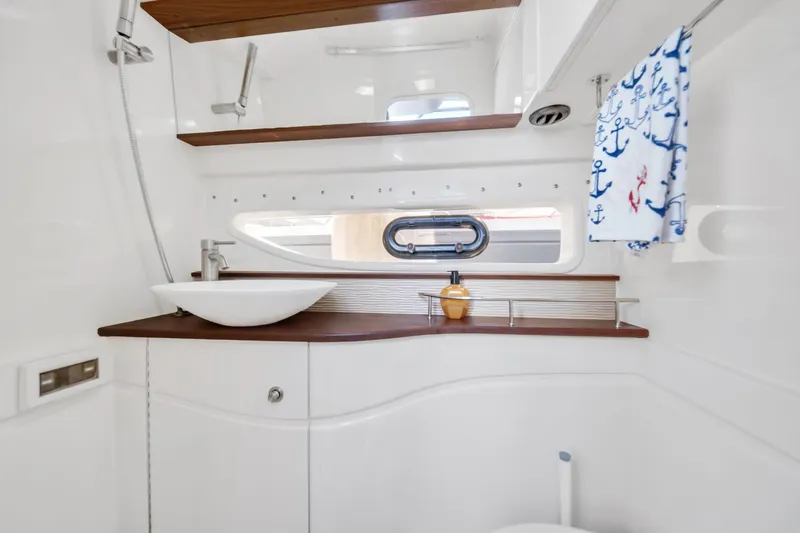  Yacht Photos Pics Luxurious bathroom interior of 2015 Sea Ray 350 Sundancer yacht with modern fixtures.