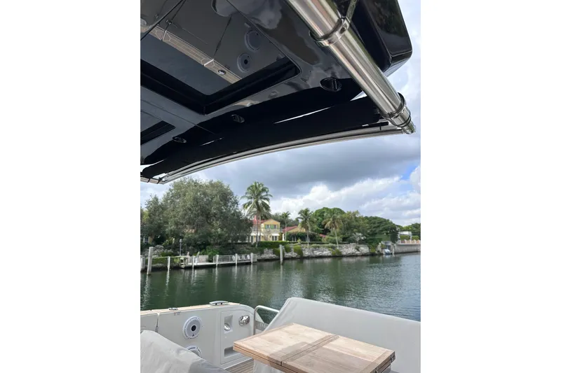 No Name Yacht Photos Pics 2024 Pardo Yachts P38 interior view with waterfront scenery and lush greenery.