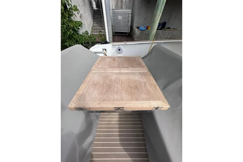 No Name Yacht Photos Pics 2024 Pardo Yachts P38 wooden deck detail with surrounding dock area.