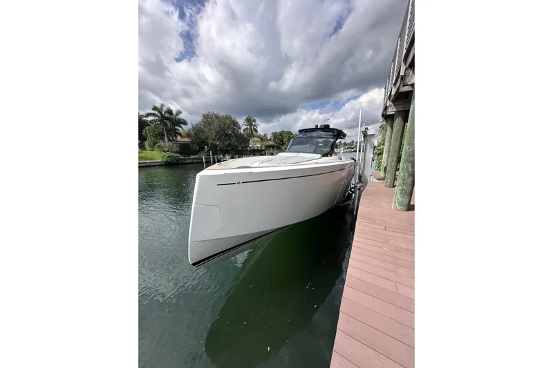 No Name Yacht Photos Pics 2024 Pardo Yachts P38 docked, sleek design, under cloudy sky.
