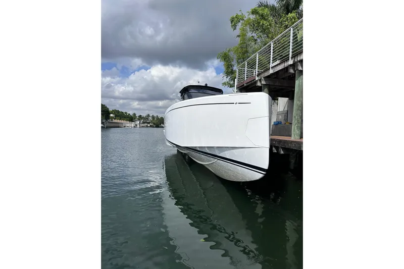 No Name Yacht Photos Pics 2024 Pardo Yachts P38 docked, sleek white design under cloudy sky.