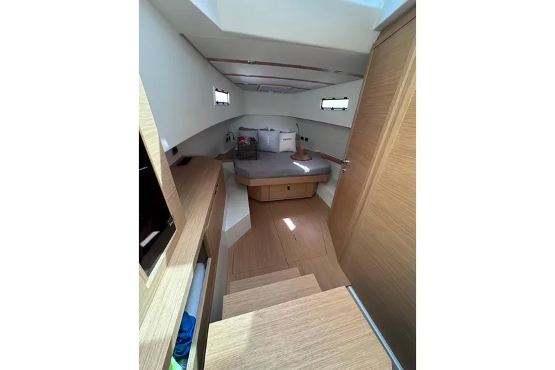 No Name Yacht Photos Pics 2024 Pardo Yachts P38 cabin interior with modern wood finish and cozy bed.