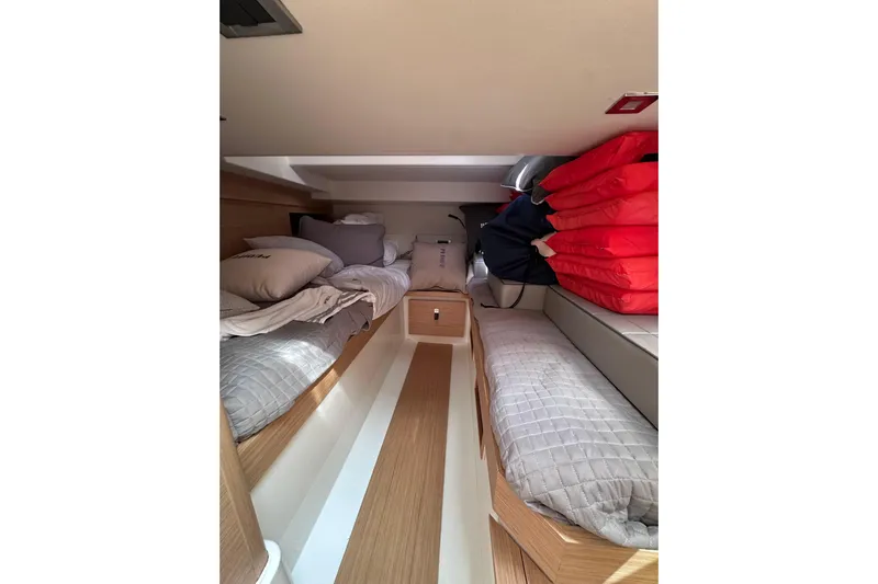 No Name Yacht Photos Pics 2024 Pardo Yachts P38 cabin interior with twin beds and red life jackets.